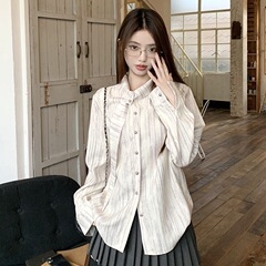 フランス式の染めはシャツの女性の春と秋の新型のゆったりしたデザイン感の長袖のストライプのシャツの大衆の上着を導いています。