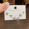 Asymmetrical set with zircon with bow, earrings, 3 piece set