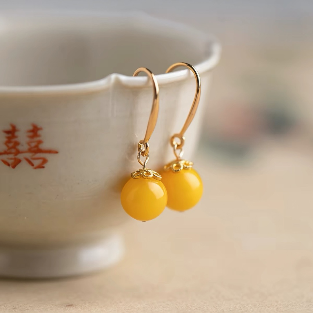 Natural amber ear hooks, chicken oil yellow old amber earrings, women's Chinese style earrings, golden amber yellow ear accessories