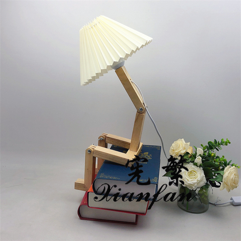 Robot creativo transfronterizo plegable dormitorio habitación escritorio lámpara de mesa decorativa tela de madera forma variable lámpara personalizada