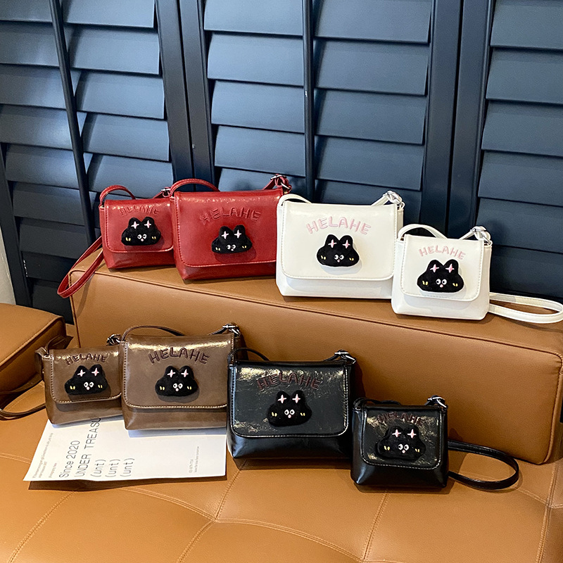 Caricatura lindo gatito niñas y niños bolsos de hombro letras extranjeras bolsos de bebé otoño y invierno nuevos bolsos de niños
