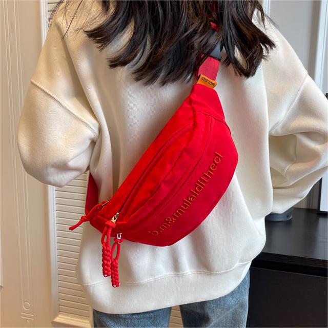 Bolso de pecho coreano de lienzo de letras mujeres 2025 nuevo bolso de hombro de estilo deportivo casual popular bolso de mochila de fuego universal