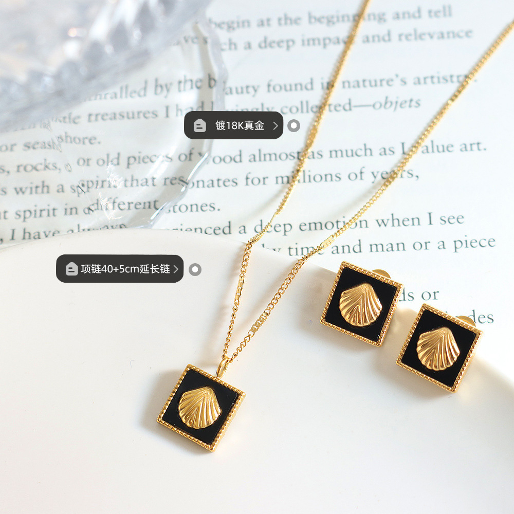 Temperamento francés incrustaciones de acrílico en relieve colgante collar personalidad pendientes moda titanio acero joyería traje