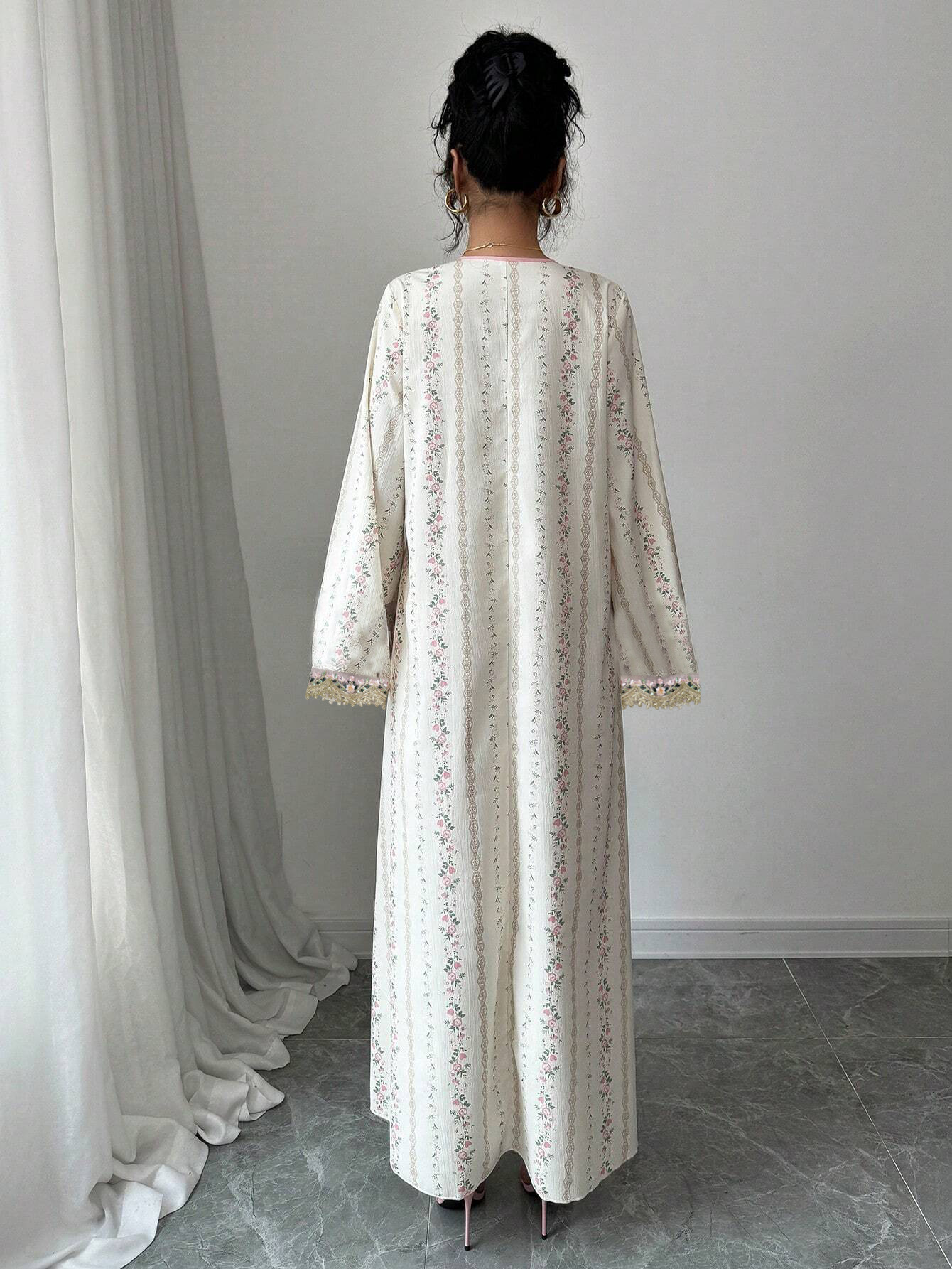 Elegant muslimsk klänning med v-ringning och spetsbroderi_voghion.com