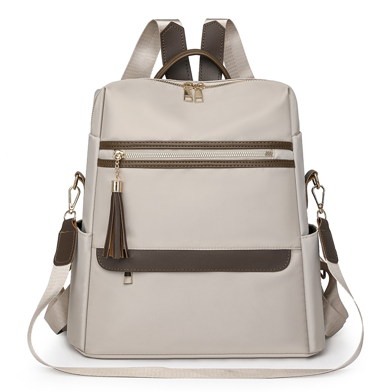 2024 verano nuevo estilo señoras mochila de nailon moda borla gran capacidad contraste color viaje mochila de un solo hombro al por mayor