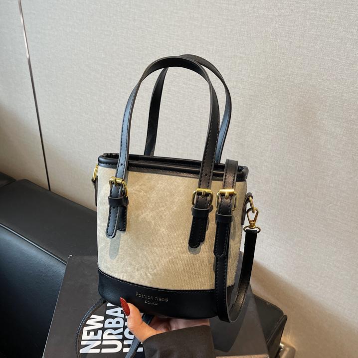 Bolso de mano de color de contraste de comercio exterior para mujer 2025 nuevo bolso de cubo de ocio salvaje simple bolso de mensajero de un solo hombro de alta gama
