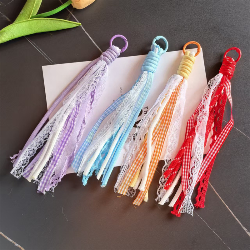 Accesorios de éxito en línea de teléfono móvil cordón de encaje de viento de dopamina accesorios bolsos llaveros colgantes al por mayor image 5