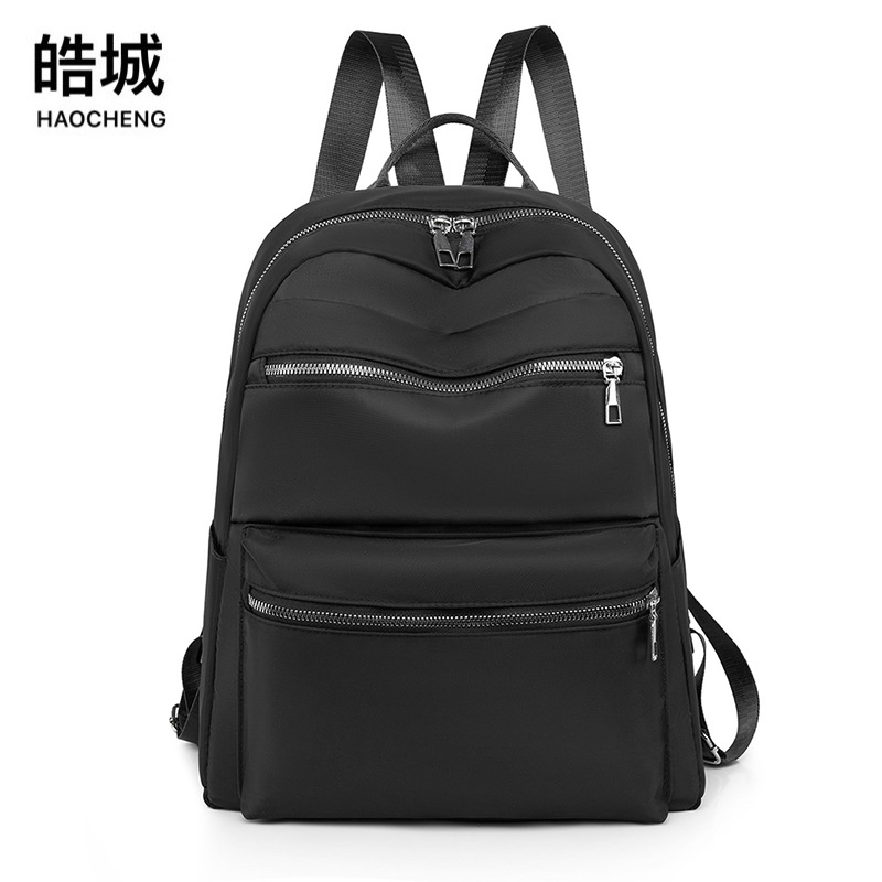 Mochila de tela Oxford para mujer 2023 nuevo estilo casual color sólido mochila para computadora de gran capacidad mochila de viaje al aire libre al por mayor