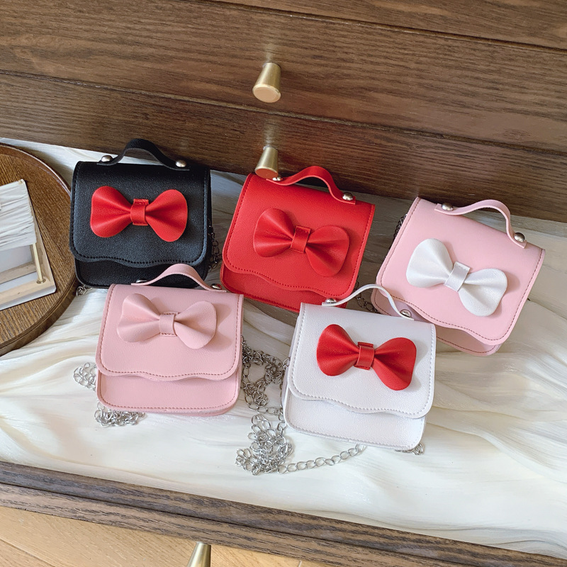 Lindo bowknot girl cadena bandolera moda color sólido bolso de bebé estilo occidental mini bolso de accesorios para niños