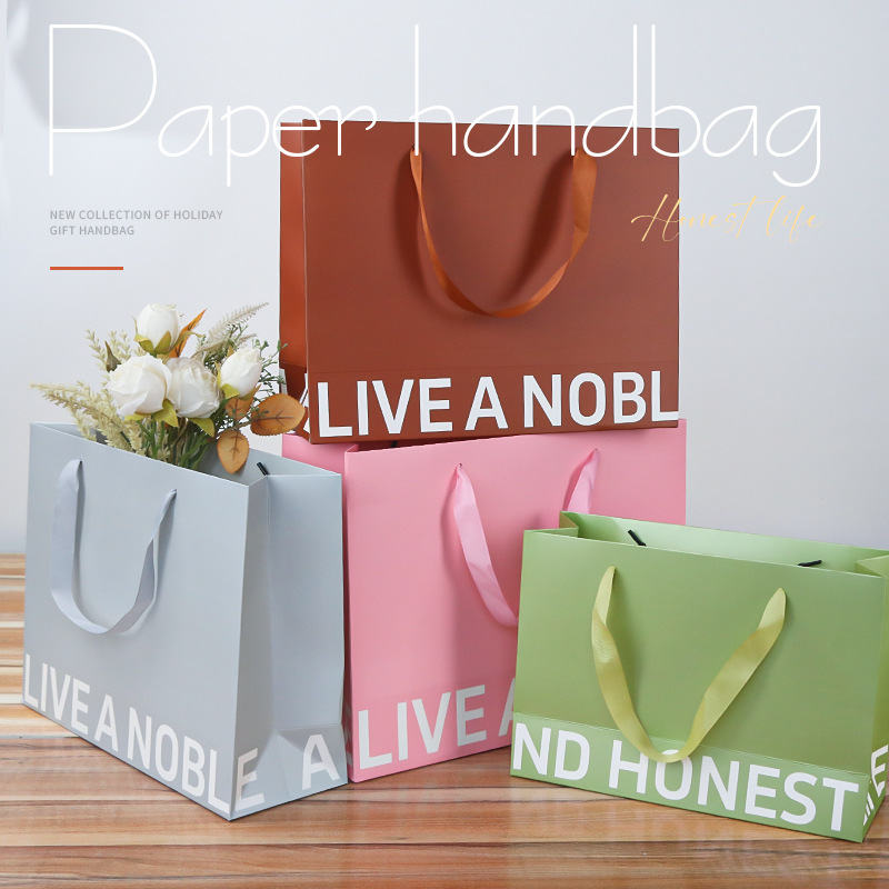 礼品袋服装店购物手提纸袋装衣服礼物加厚覆膜白卡纸定做高档袋子