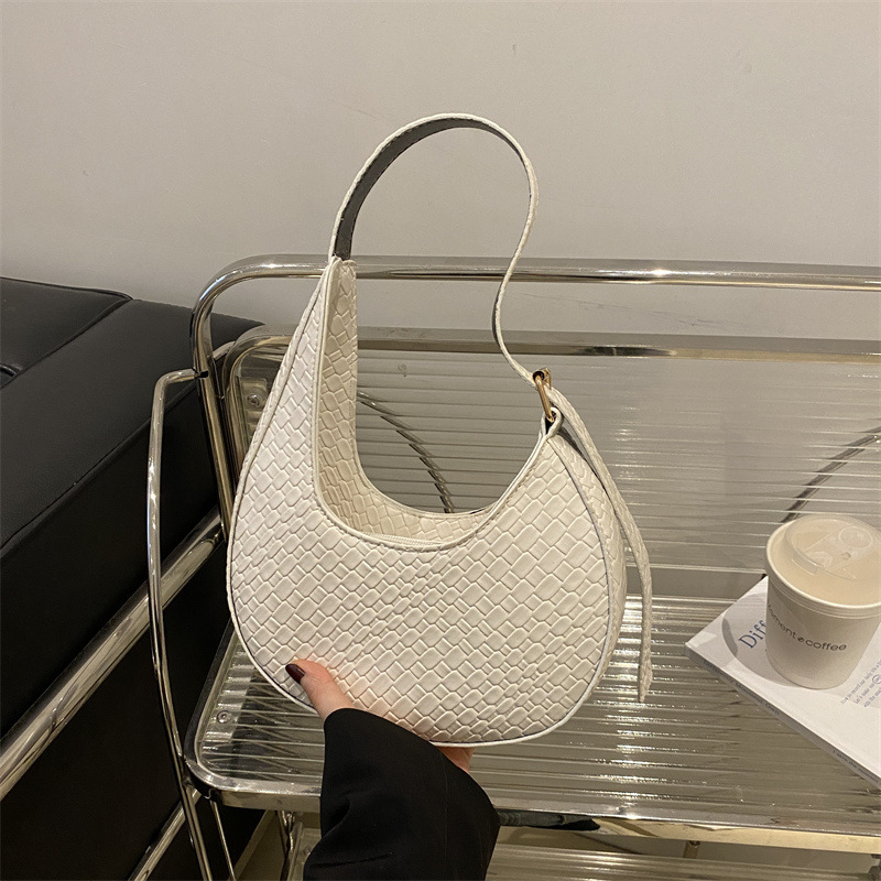 Bolsa de media luna francesa de tejido para mujeres 2025 nueva tendencia correa de hombro ancha textura de moda bolso de hombro bolso debajo de la axila