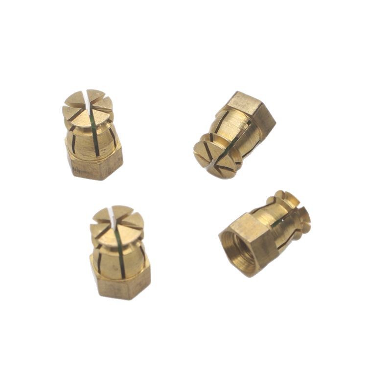 Tuerca de cobre expandida de fábrica M4 muebles hexagonales piezas de conexión cuatro en uno tuerca incrustada bisagra piezas incrustadas de cobre