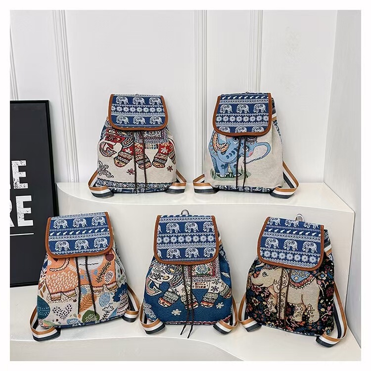 外国貿易の民族風の大きいサイズの肩のリュックサックの刺繍の象の猫のズックの布の包みの女性の旅行は雲南の刺繍の包みを包みます|undefined