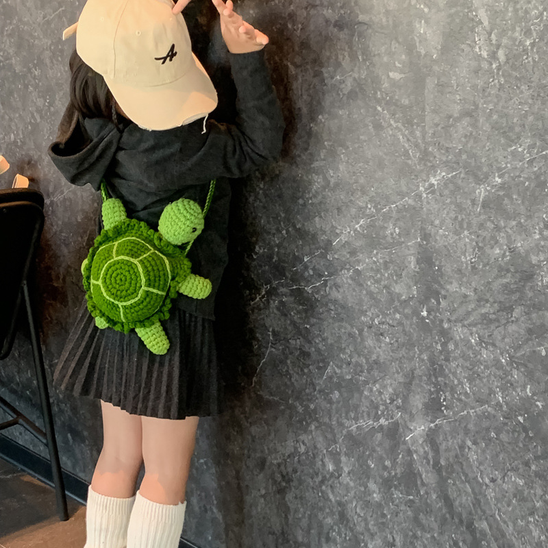 2025 otoño y invierno nuevo bolso infantil lana gancho tejido pequeña tortuga bebé bolso de cambio caricatura lindo mochila de hombro