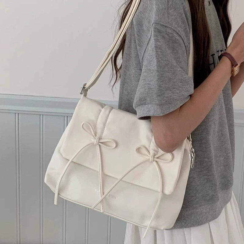 Cute fuchsia shoulder bag with bow, capacious one-shoulder bag