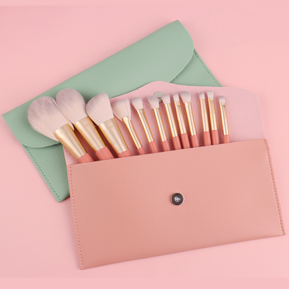 Zhuolya nuevo maquillaje cepillo traje herramientas de belleza bolsa de almacenamiento sombra de ojos corrector 12 pinceles de maquillaje conjunto completo Al Por Mayor