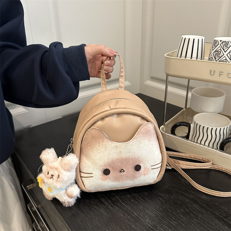 Estudiantes de clase gato tostado mochila de hombro personalidad femenina universal moda casual alta sensación mochila