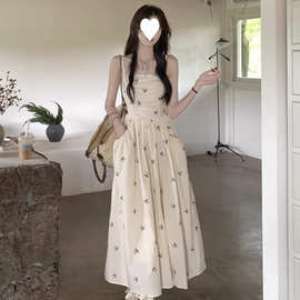 设计感抹胸吊带连衣裙女夏季2025新款印花蝴蝶结收腰褶皱口袋长裙