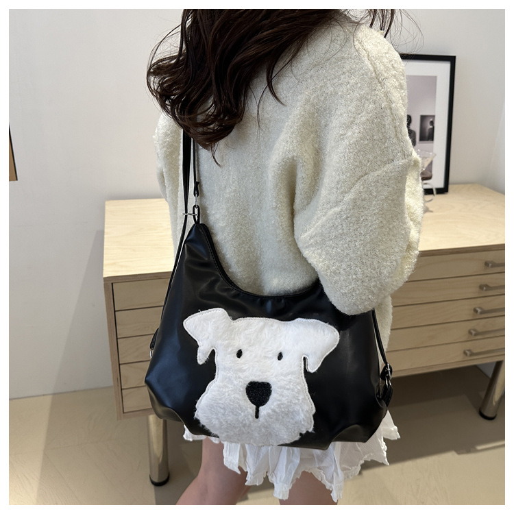 The new autumn and winter 2024 fashion cartoon backpack with simple, individual and niche design, single-shoulder bag and commuter tote bag undefined