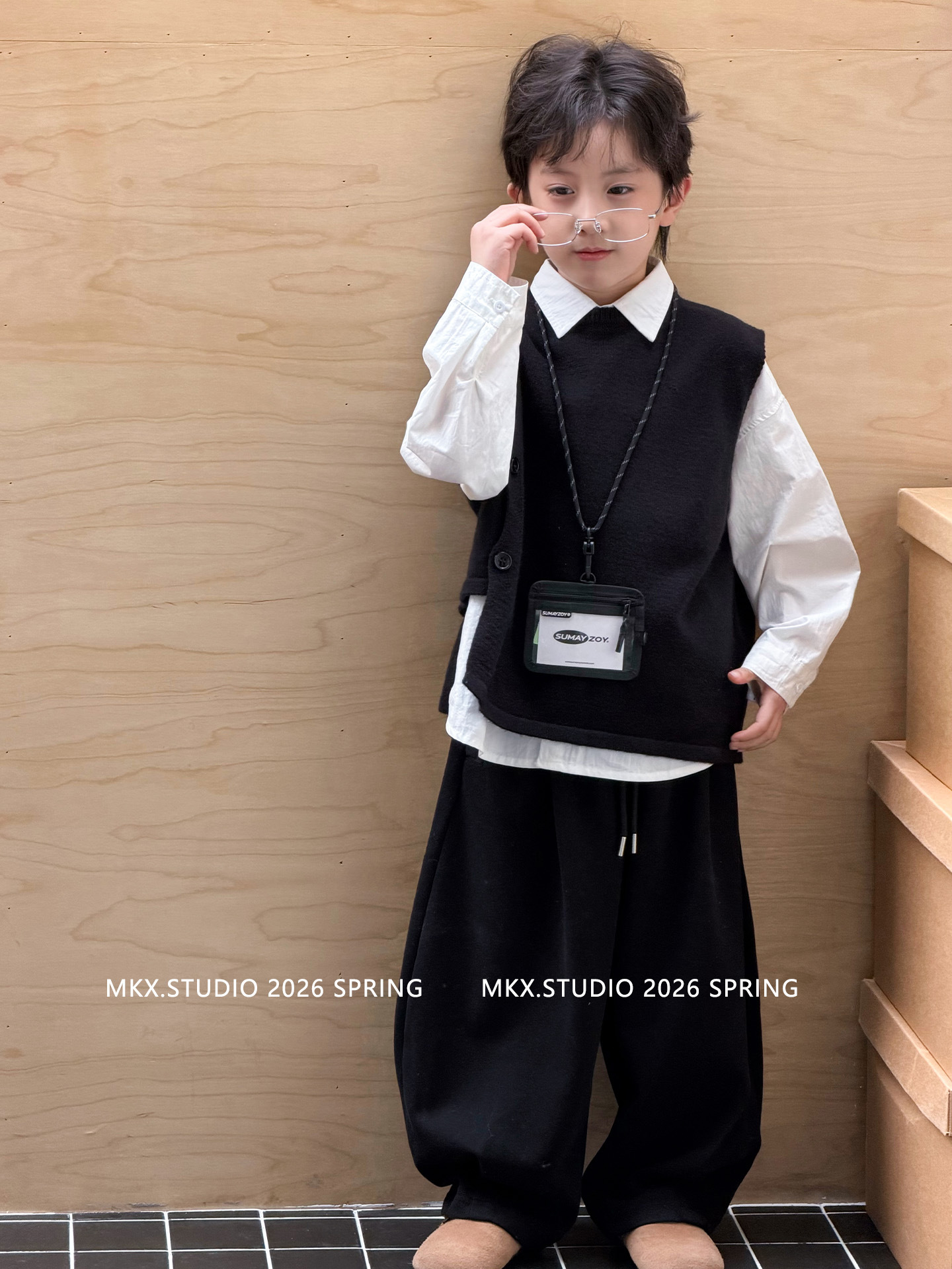 Suéter infantil camiseta de punto chaleco de punto para niños primavera y otoño 2026 ropa de niños de edad media chaleco de estilo universitario