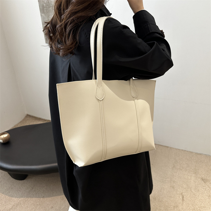Bolsa coreana de gran capacidad de color sólido para mujeres 2024 nueva moda retro bolso de viaje simple bolso de hombro sólido