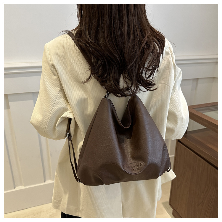 The 2024 new pleated tote bag is a large-capacity casual and fashionable backpack for women, featuring multi-functional texture and a single-shoulder crossbody bag undefined
