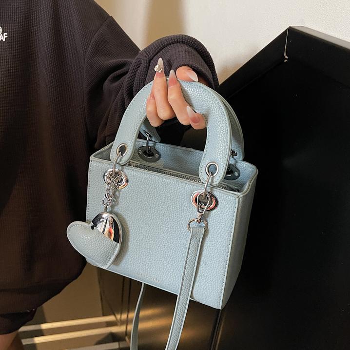 Bolso de mano de alta gama de comercio exterior para mujer 2025 nuevo bolso de hombro de todo fósforo de nicho de estilo occidental bolso de mensajero de moda