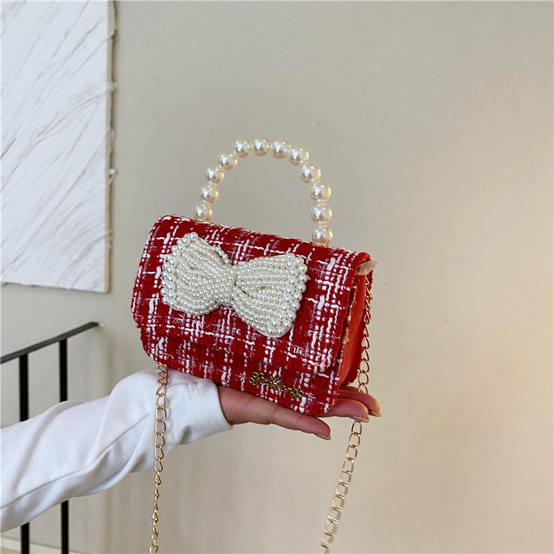 Mochila de niños estilo extranjero princesa perla de viento pequeño cambio bolso de hombro de niña encantadora