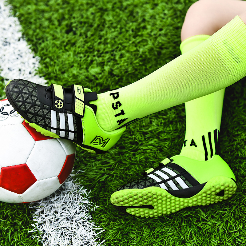 工場直売サッカー靴男の子と女の子の長い釘のくぎの靴の学生の試合の訓練靴の卸売りの長い釘の運動靴|undefined