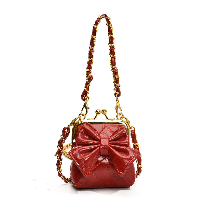 Bolsos de hombro de princesa de estilo estilo diamante sólido arco bolso de hombro para niños nueva cadena bolso de abrazadera para niños