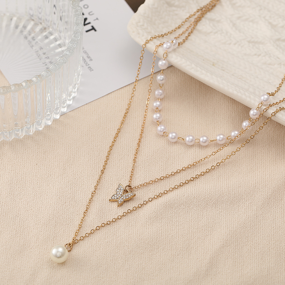 2022 New Creative Simple Pearl Diamond Butterfly Pendant Three Layer Necklace display picture 3