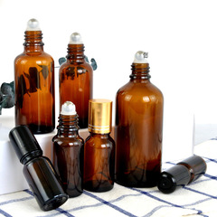 Tea-colored glass bead oil essence bottle cosmetic bottle small sample dividing bottle steel bead rolling perfume bottle empty bottle wholesale