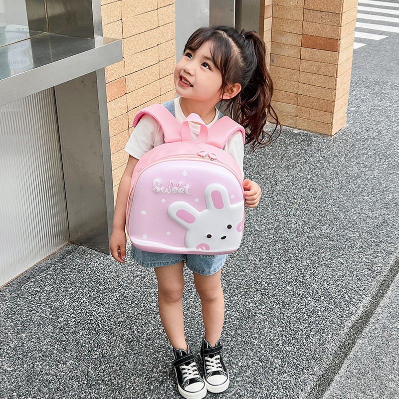 Jardín de infantes lindas mochila de dibujos animados para niños, mochila de cáscara de huevo de conejo, mini mochila para niños y niñas.