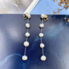 Organic silver needle, earrings from pearl with tassels, silver 925 sample