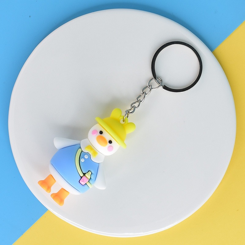 Muñeca de dibujos animados goteo llavero bolsas escolares exquisitas para hombres y mujeres colgantes para agarrar muñecas colgantes para el mercado nocturno regalos al por mayor