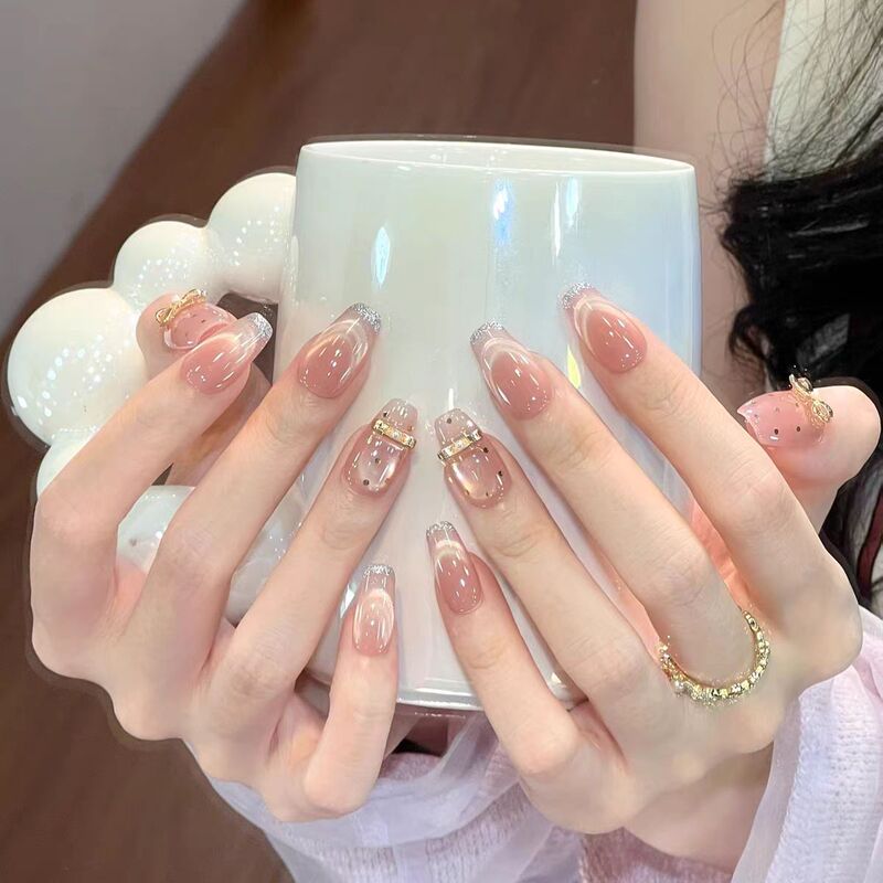 Handmade Nail Art with Ballet-Style Polka Dots, Bowknots, Cat-Eye Nail Stickers, Gold Powder, and a Cool, Elegant Look That Enhances Complexion Handmade Nail Art with Ballet-Style Polka Dots, Bowknots, Cat-Eye Nail Stickers, Gold Powder, and a Cool, Elegant Look That Enhances Complexion