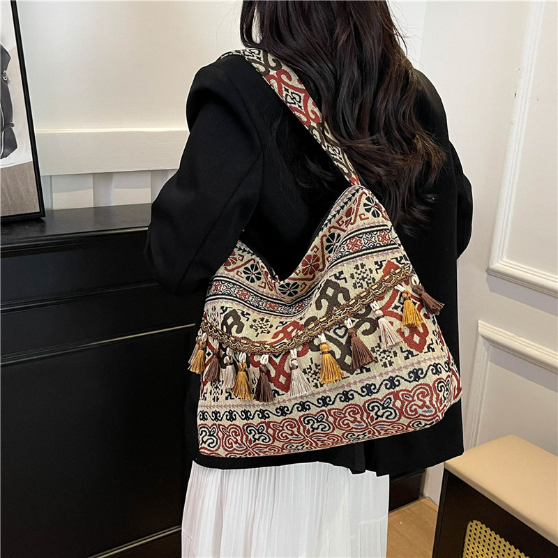 Bolsos de gran capacidad de estilo nacional para mujeres 2025, nueva moda extranjera, bolsas de hombro de borda, bolsas de compras al aire libre