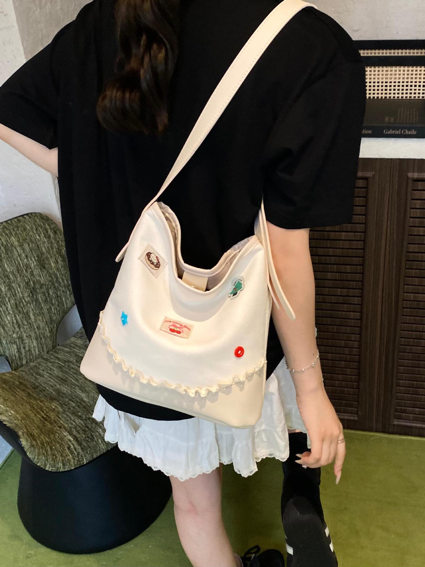 Bolso de cubo de ocio de color de contraste transfronterizo para mujer 2025 nuevo bolso de hombro de tendencia de moda salvaje bolso de mensajero de viaje de trabajo