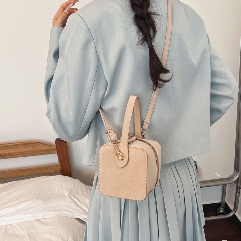 Nicho de textura caja de mano bolso mujer 2026 nuevo bolso de moda bolso de color sólido bolso de maquillaje bolso de lápiz labial