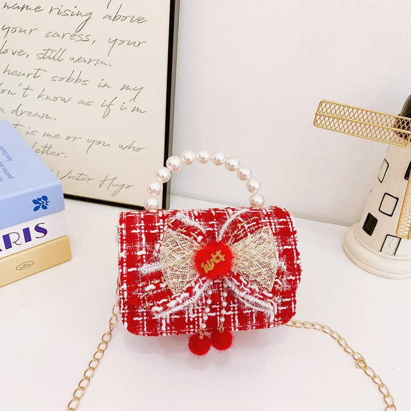 Nuevo bolso de hombro de niñas lindo arco bolso de perla bebé 2025 bolso rojo pequeño viento perfumado bolso para niños