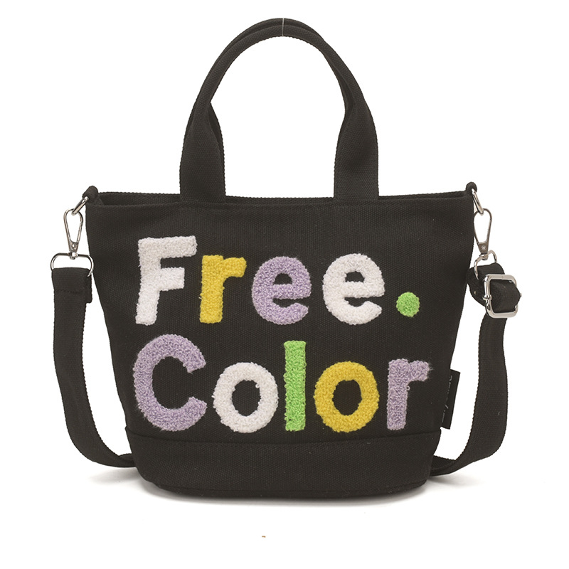 Mamá bolso para salir bolso de cubo de mano mujer 2026 nuevo bolso de lona bordado de dibujos animados letras casuales bolso de mochila