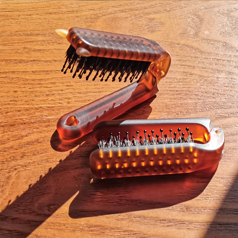 Nuevo ámbar plegable melina de cerdo peine portátil para viajar damas cabello rizado peine de estilo suelto