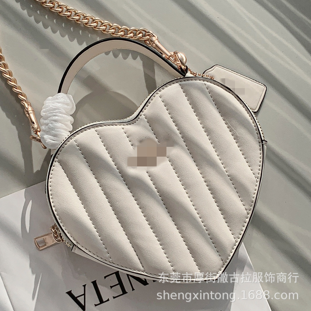 出口大牌外贸原单潮爱心手提斜挎包 腋下酒神包真皮单肩包尾单女