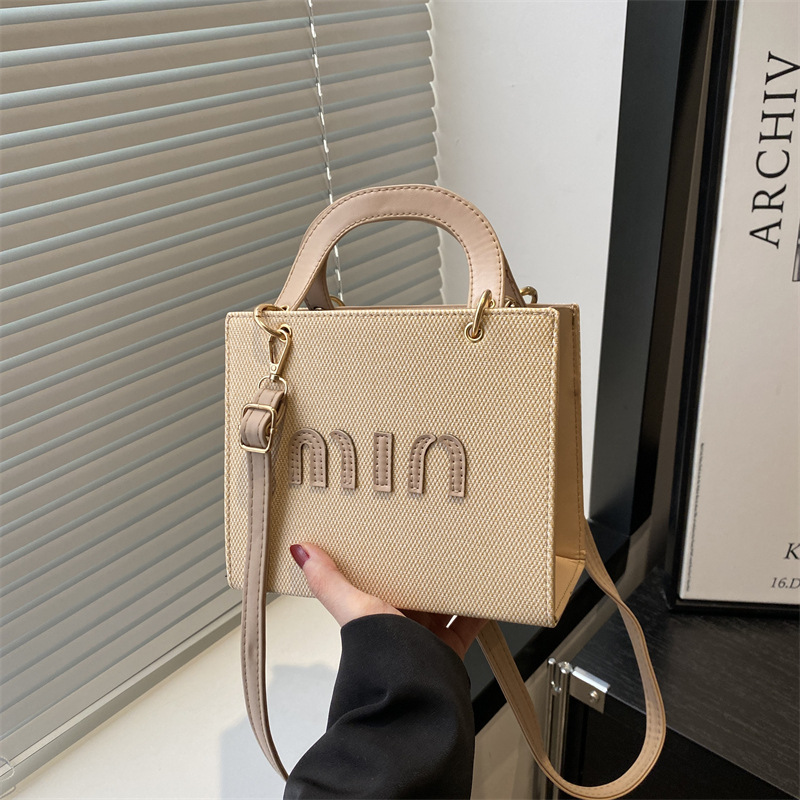 Bolso de mano de moda al por mayor color contraste bolso de mujer 2025 verano nueva letra de lujo bolso de hombro de viaje mochila