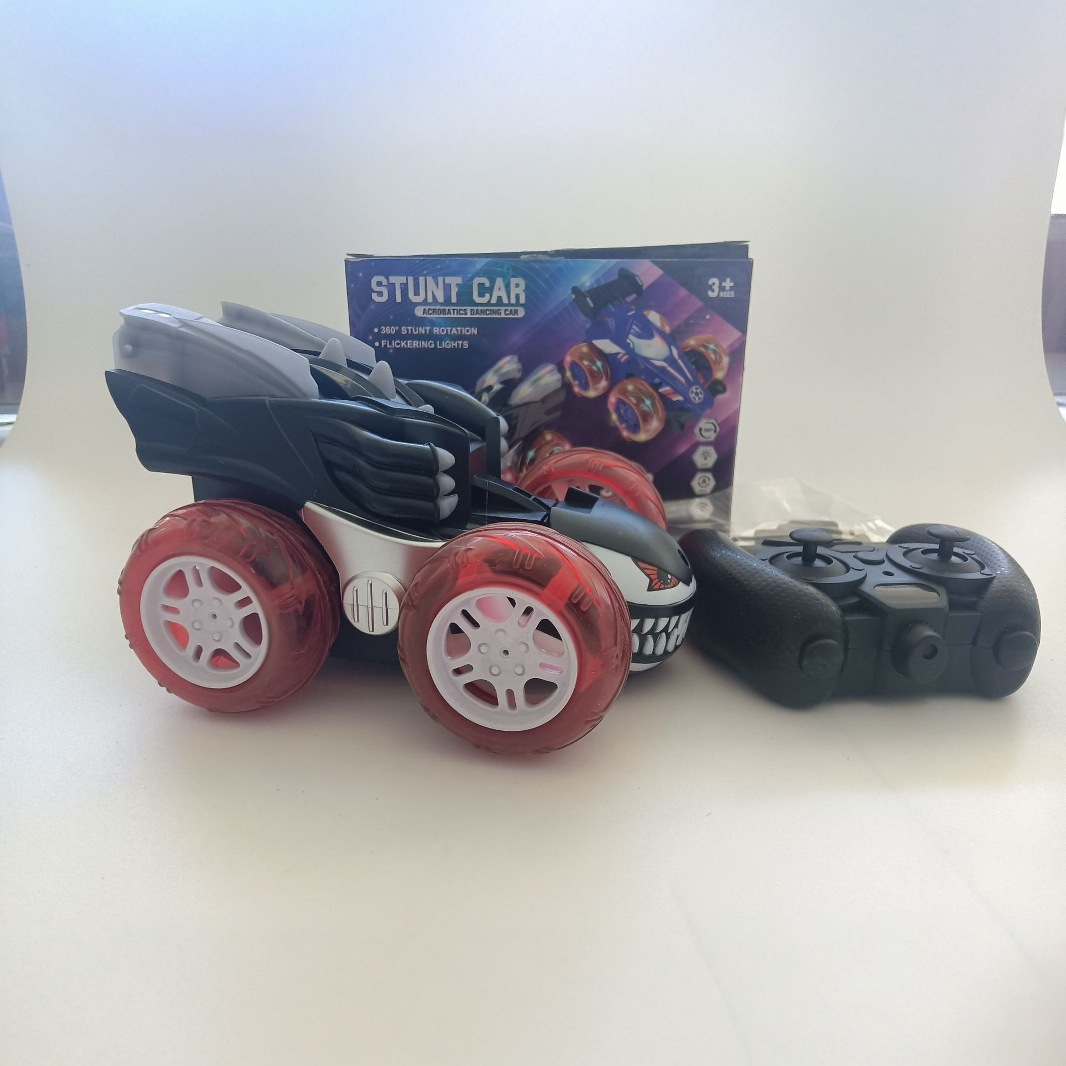 Cross-border 2.4G veneno acrobacias carro de rol juguetes para niños F1 360 grados veneno y ruido carro de control remoto