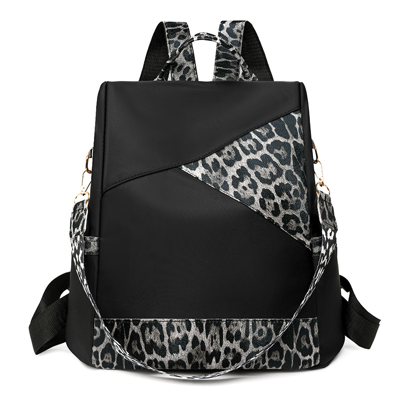 Nueva mochila con estampado de leopardo para mujer 2024 nueva mochila de viaje de todo fósforo de moda de gran capacidad mochila escolar para estudiantes de un solo hombro