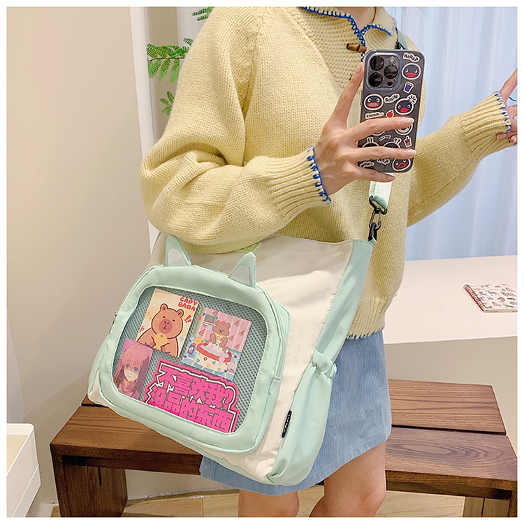 The new cute cartoon printed student bag with a large capacity and transparent student storage single-shoulder bag is selling well for women undefined