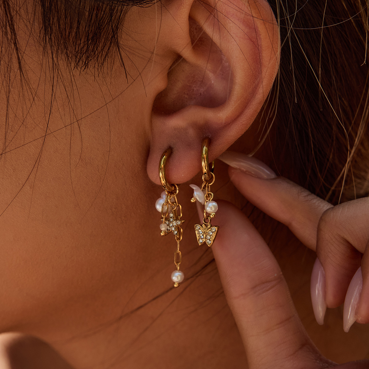 Wanxing Pendientes de perlas europeas y americanas Pendientes de acero inoxidable Pendientes de lujo ligero de alta gama Diseño de joyería de oro de nicho de 18 quilates