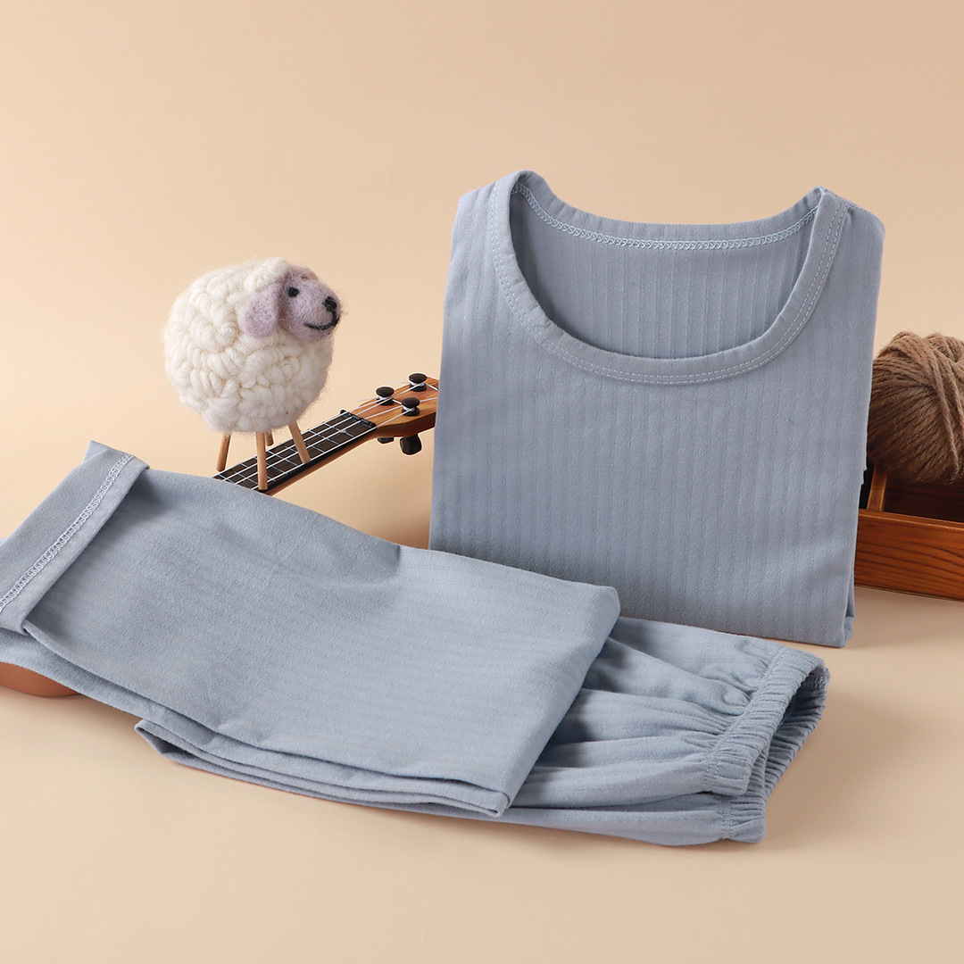 Nueva ropa infantil para el hogar sin huesos pijamas de manga larga primavera y otoño ropa de aire acondicionado de niñas algodón hombre