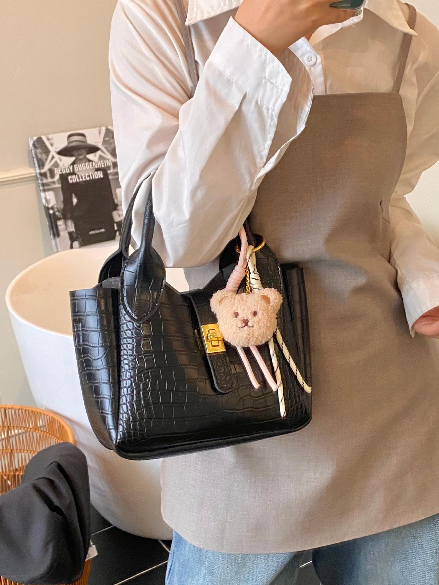 Comercio exterior super fuego patrón de cocodrilo llevar a mano bolso de cubo mujer 2025 nuevo bolso de hombro de viaje de moda bolso de mensajero de todo fósforo